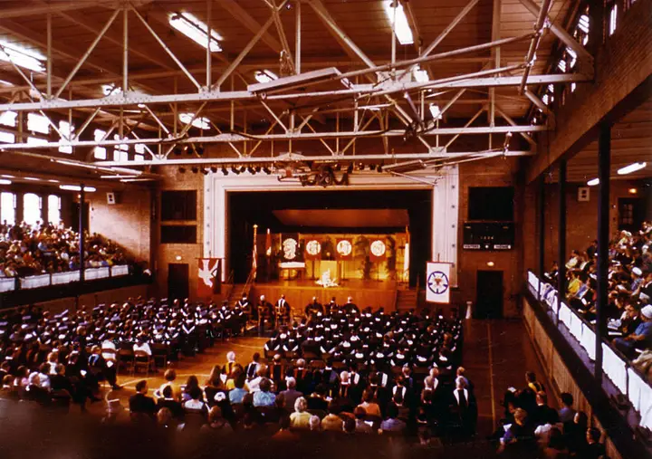 A graduation ceremony within the gym building.