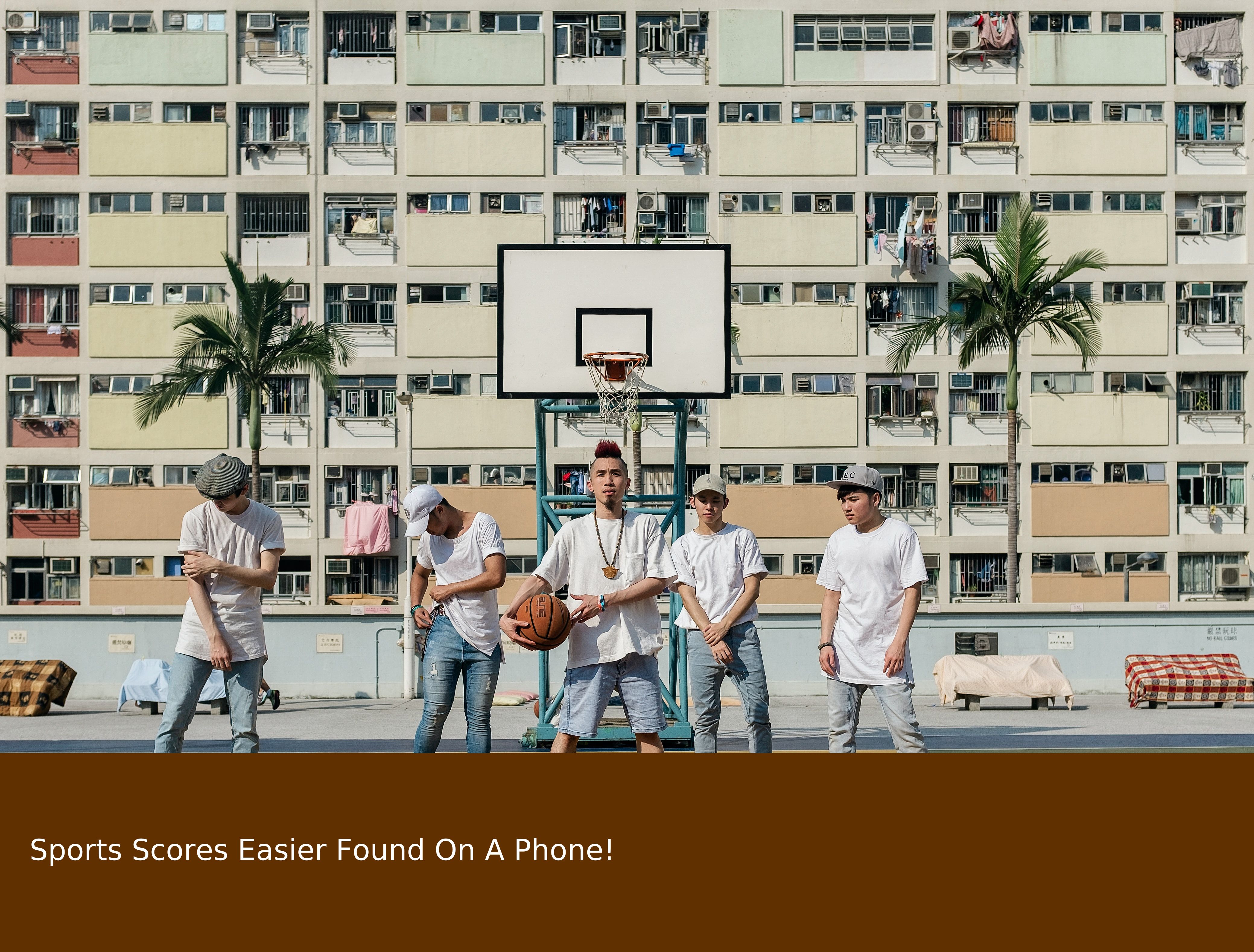 Basketball players in Hong Kong with a large box obstructing the lower 10% of the picture.