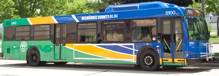Milwaukee County bus with Milwaukee County Blog written along the top.