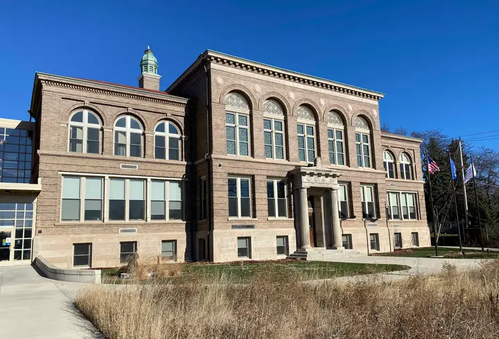 The building as it looks today. Very similar in appearance with a field in front.