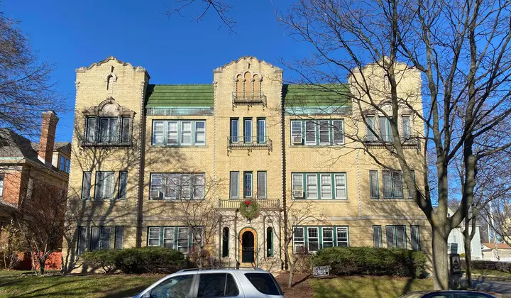 Front of the cream city brick building.