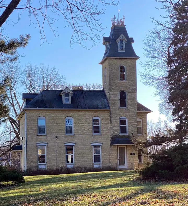 The cream city brick tower house today after a restoration.